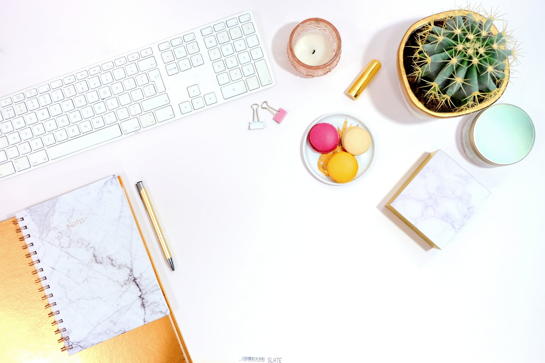 flat lay desk - keyboard macarons