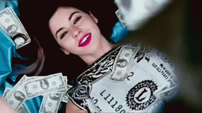 How to make a six figure salary before 30 - money dollar bills falling on woman